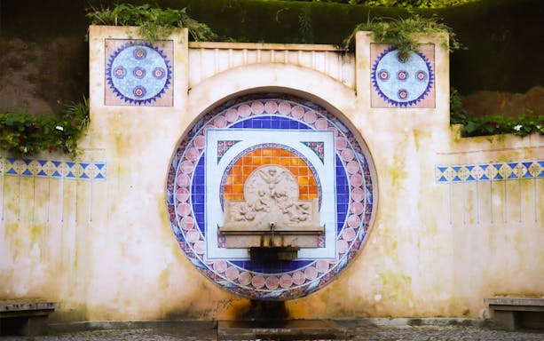 Decorative fountain with intricate tilework in Sintra, Portugal, featured on a guided walking tour.
