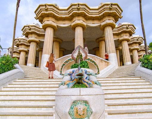 Tourists near the dragon staircase at Park Güell, Barcelona.