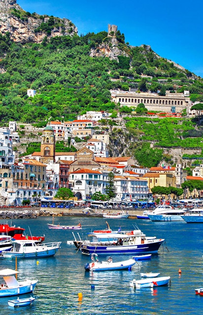Amalfi Coast Italy scenic view with colorful cliffside buildings and Mediterranean Sea.