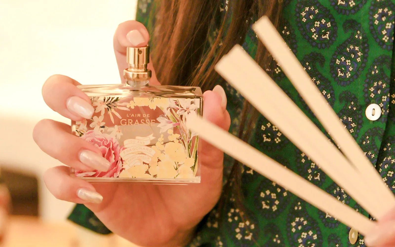 Fragonard perfume bottle held with scent strips during Opéra Garnier visit.