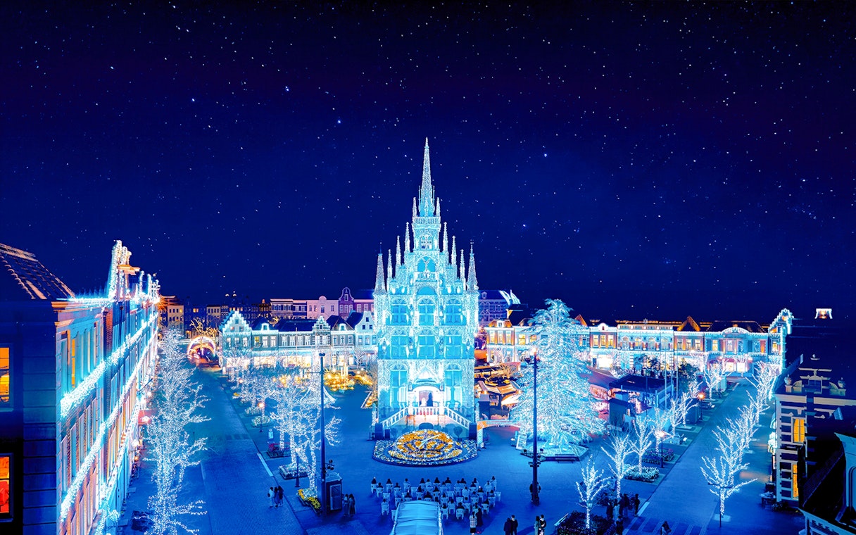 Huis Ten Bosch illuminated at night with festive lights, Nagasaki, Japan.