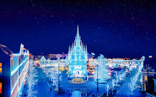 Huis Ten Bosch illuminated at night with festive lights, Nagasaki, Japan.