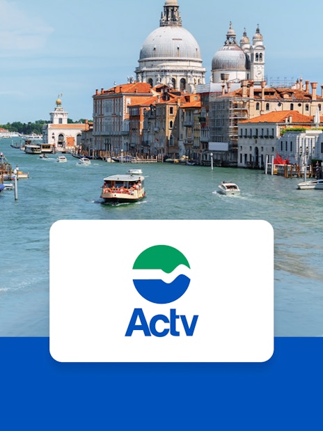 Vaporetto ACTV water bus on Venice's Grand Canal with passengers onboard.