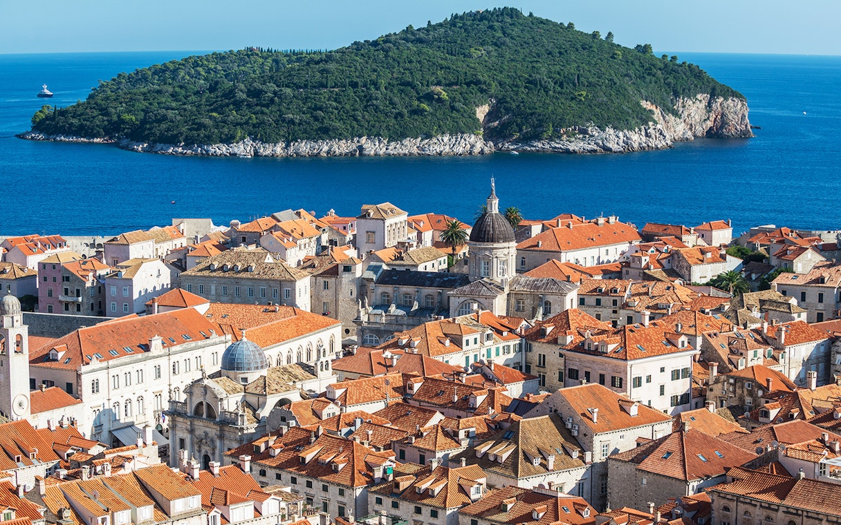 Dubrovnik old town with Lokrum Island in the background, view from a kayaking tour.