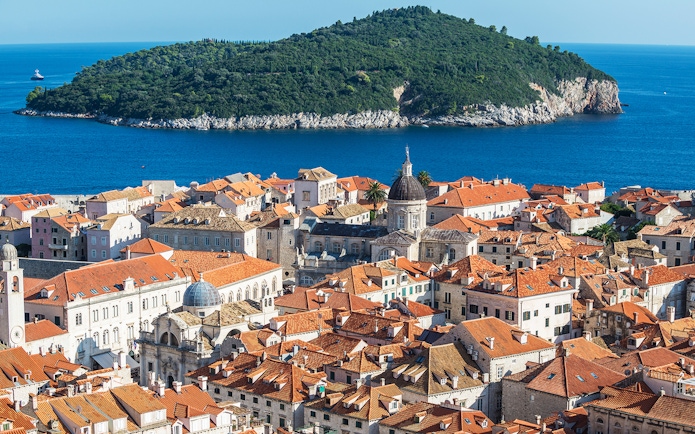 Dubrovnik old town with Lokrum Island in the background, view from a kayaking tour.