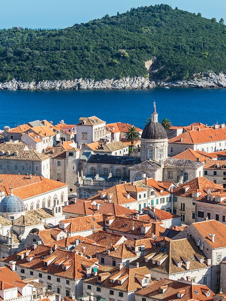Dubrovnik old town with Lokrum Island in the background, view from a kayaking tour.
