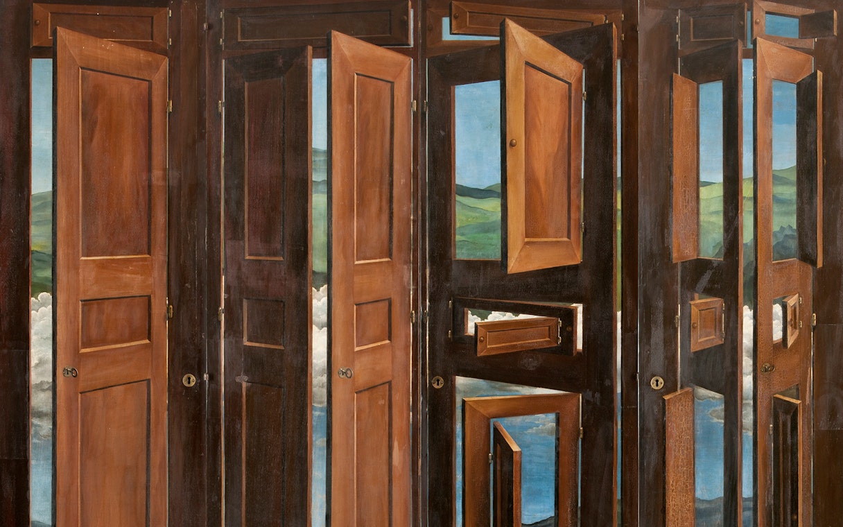 Surrealist wardrobe with open doors revealing landscapes by Marcel Jean at MAPFRE, Madrid.