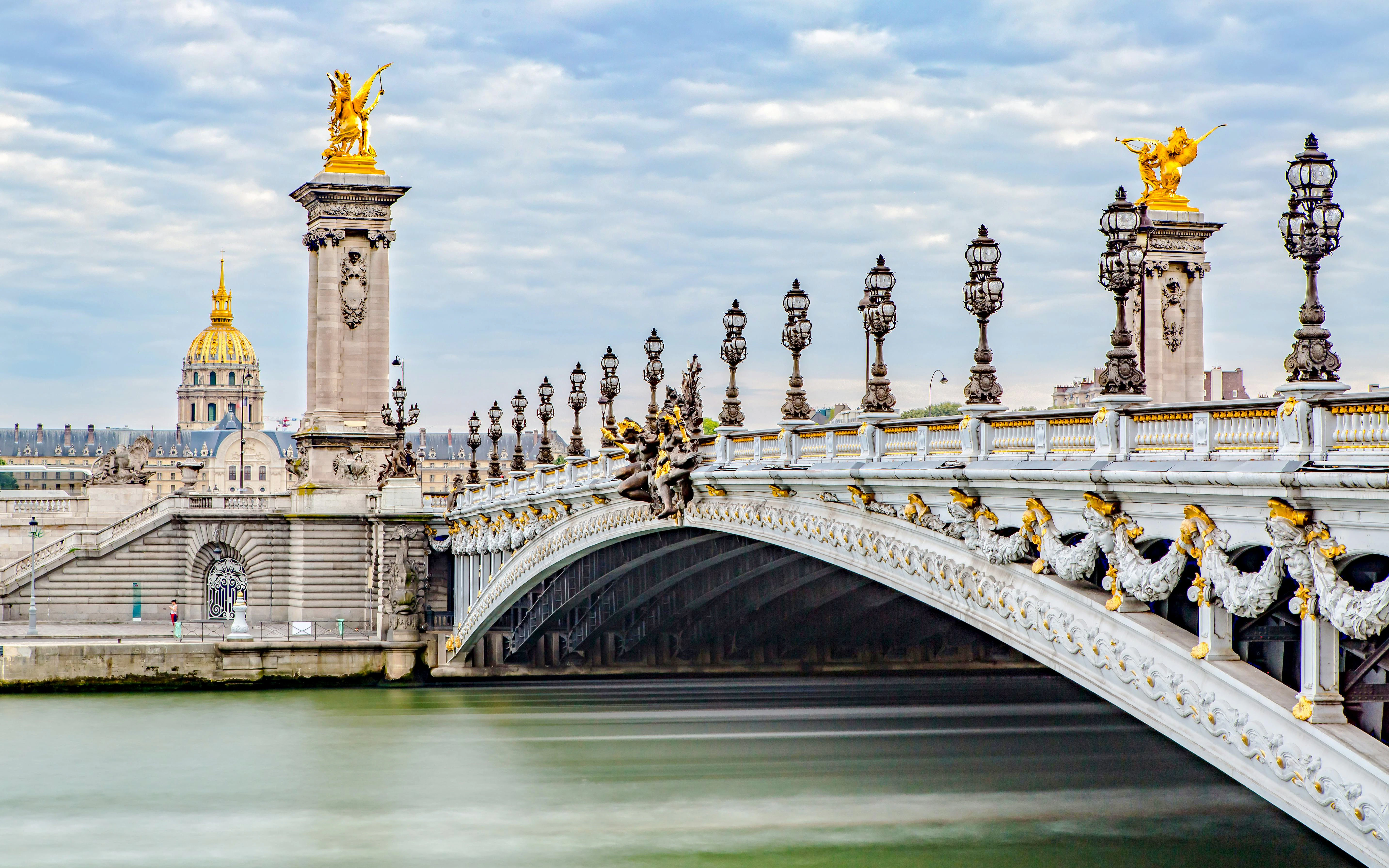 Pont Alexandre III bridge with ornate sculptures near Quai Branly, Paris.