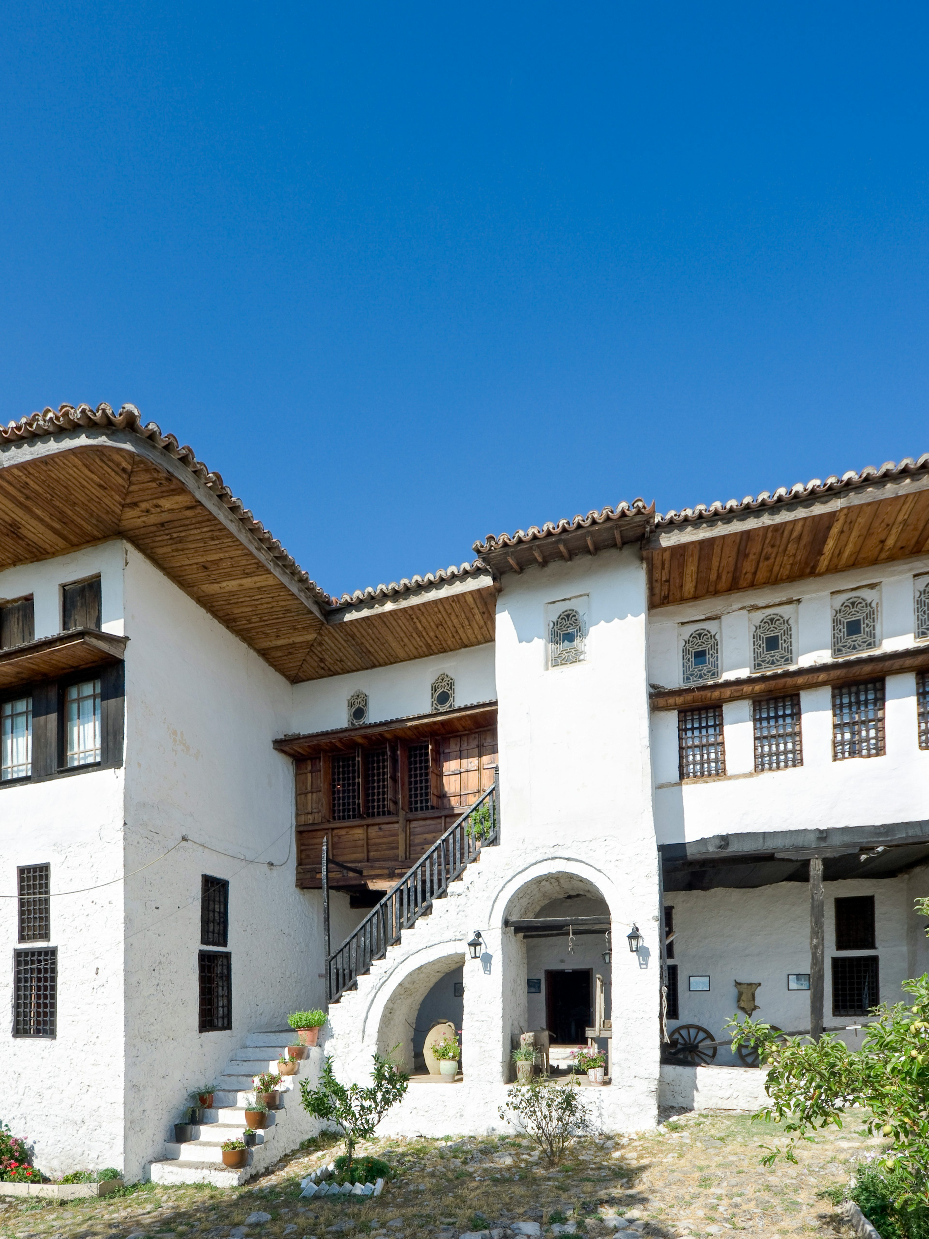 National Ethnographic Museum in Kruja with Albanian flag in foreground.