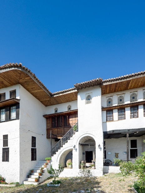 National Ethnographic Museum in Kruja with Albanian flag in foreground.