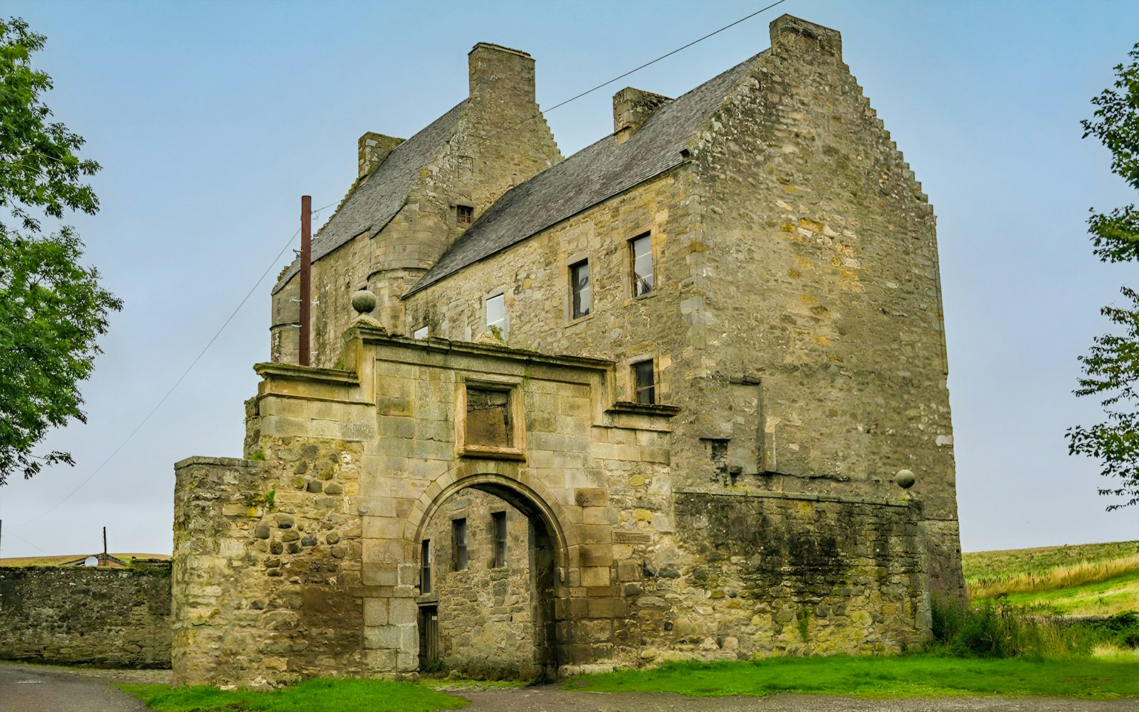 Stone castle entrance on the Loch Ness Cruise and Outlander Day Tour from Inverness.