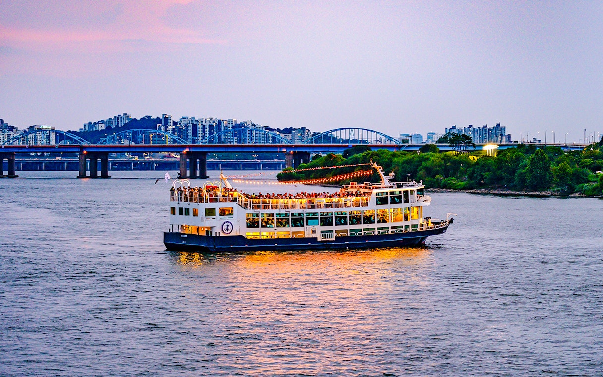 Sunset cruise on Eland Cruise ship with cityscape view, Seoul.