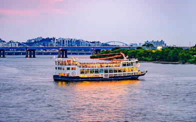 Sunset cruise on Eland Cruise ship with cityscape view, Seoul.