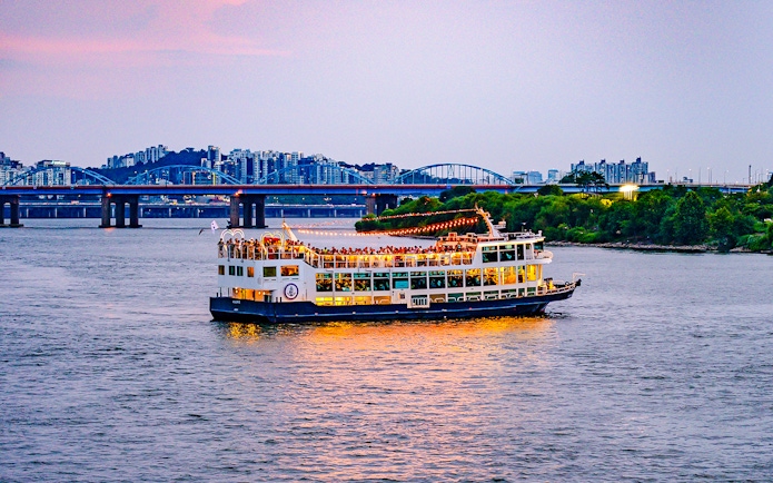Sunset cruise on Eland Cruise ship with cityscape view, Seoul.