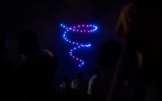 Drone light display at Camp Nou during night event, Barcelona.
