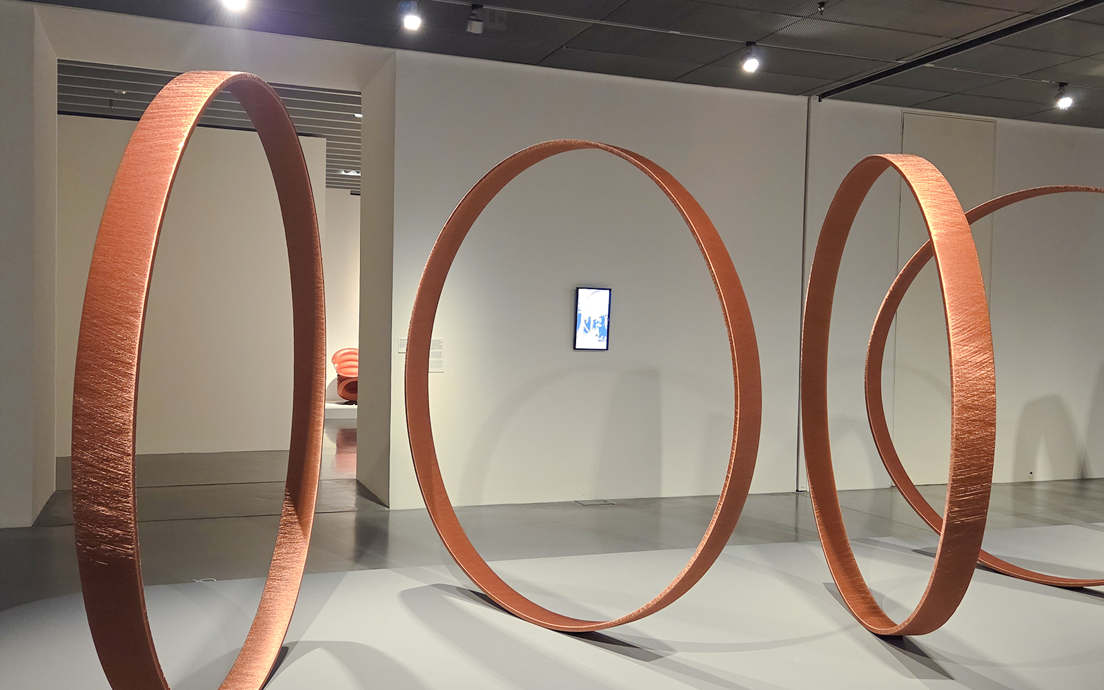Large circular sculptures in Centre Pompidou Malaga exhibition interior.
