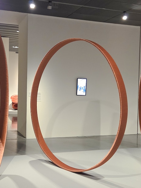 Large circular sculptures in Centre Pompidou Malaga exhibition interior.