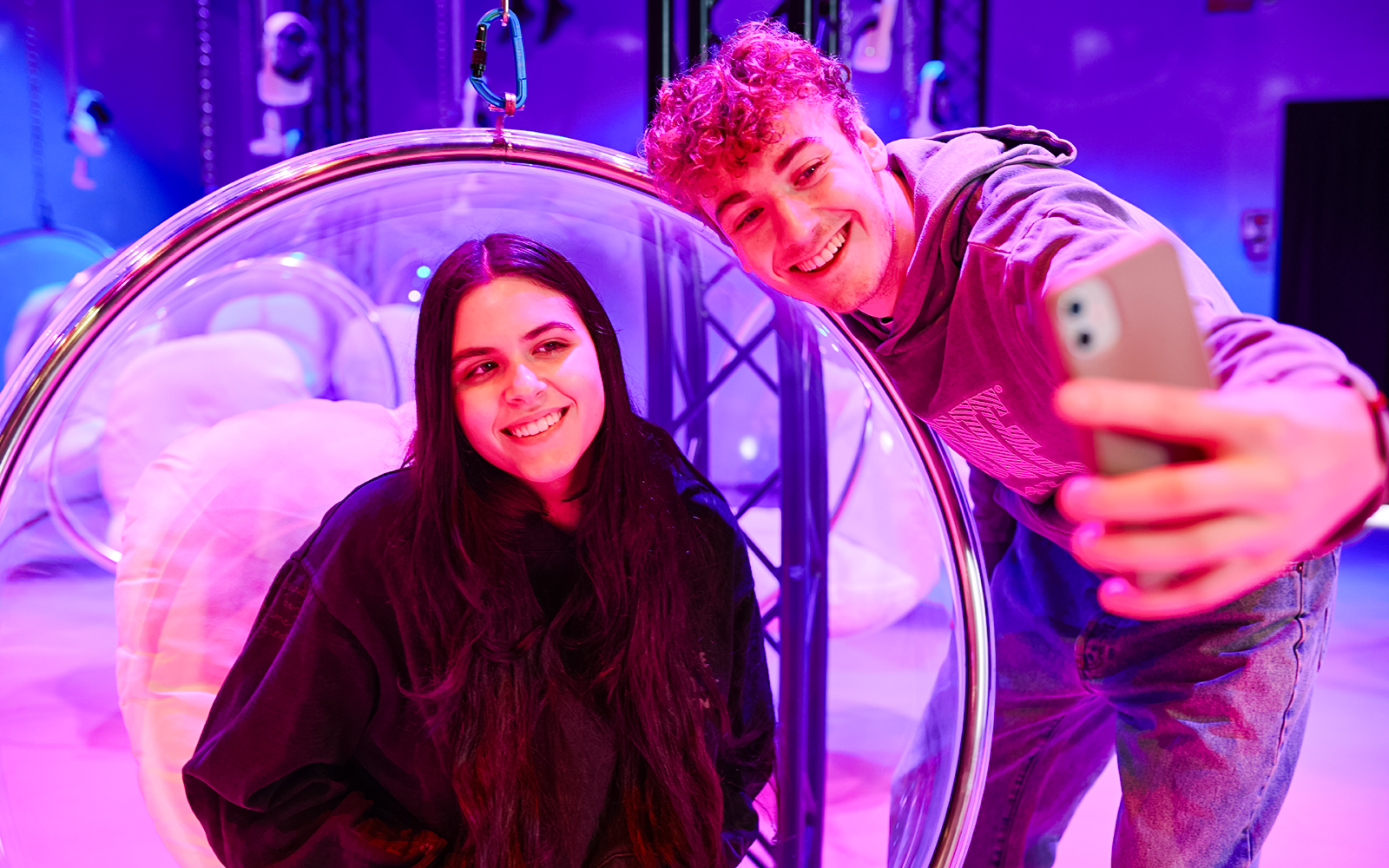Visitors taking a selfie inside Bubble Planet exhibit, Washington DC.