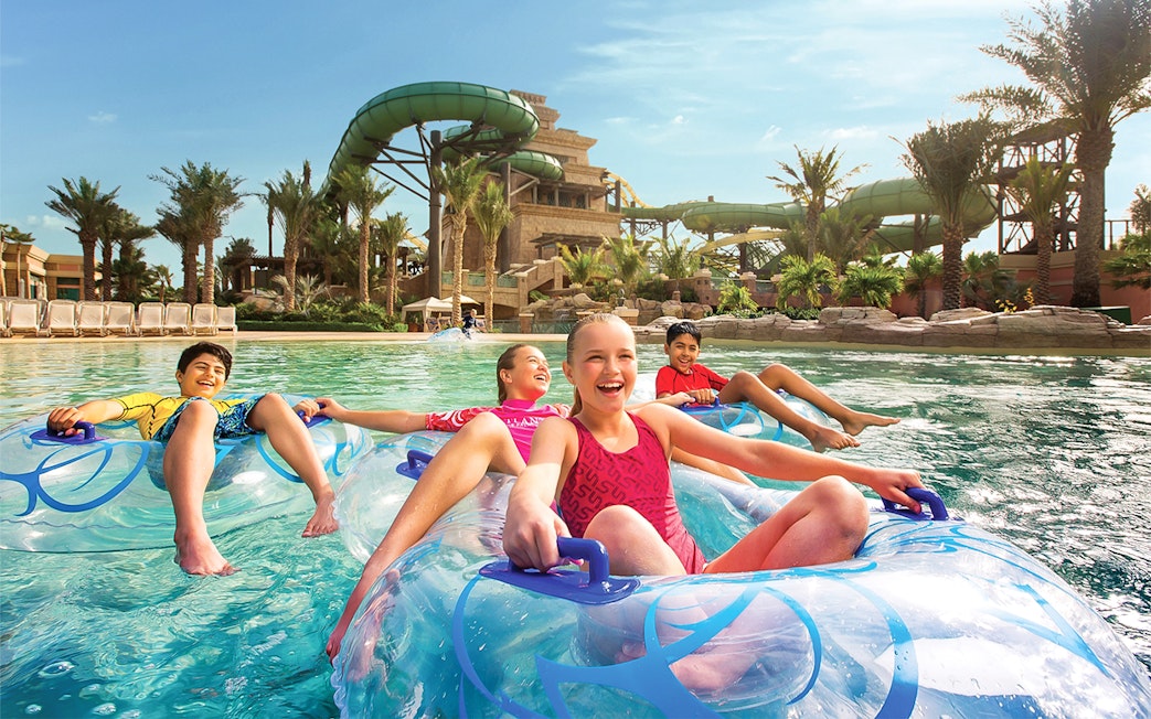 Kids enjoying water rides at Aquaventure water park.