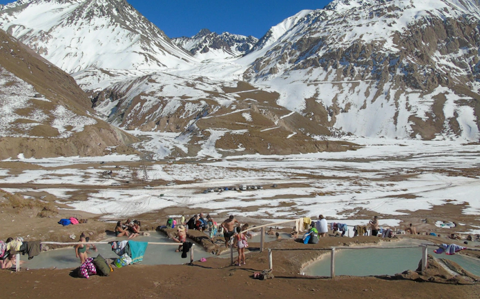 Visitors enjoying hot springs at Valle Colina, Cajon del Maipo, Andes, Santiago, Chile.