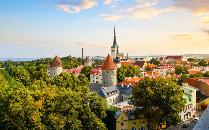 View from Toompea Hill of Tallinn's medieval walled city with red-roofed towers, Estonia.
