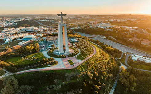 Christ the King statue overlooking Lisbon, part of Arrábida & Sesimbra wine tour experience.