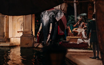 Elephant statue and performers at World of Discoveries Interactive Digital Exhibition.