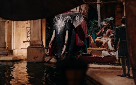 Elephant statue and performers at World of Discoveries Interactive Digital Exhibition.