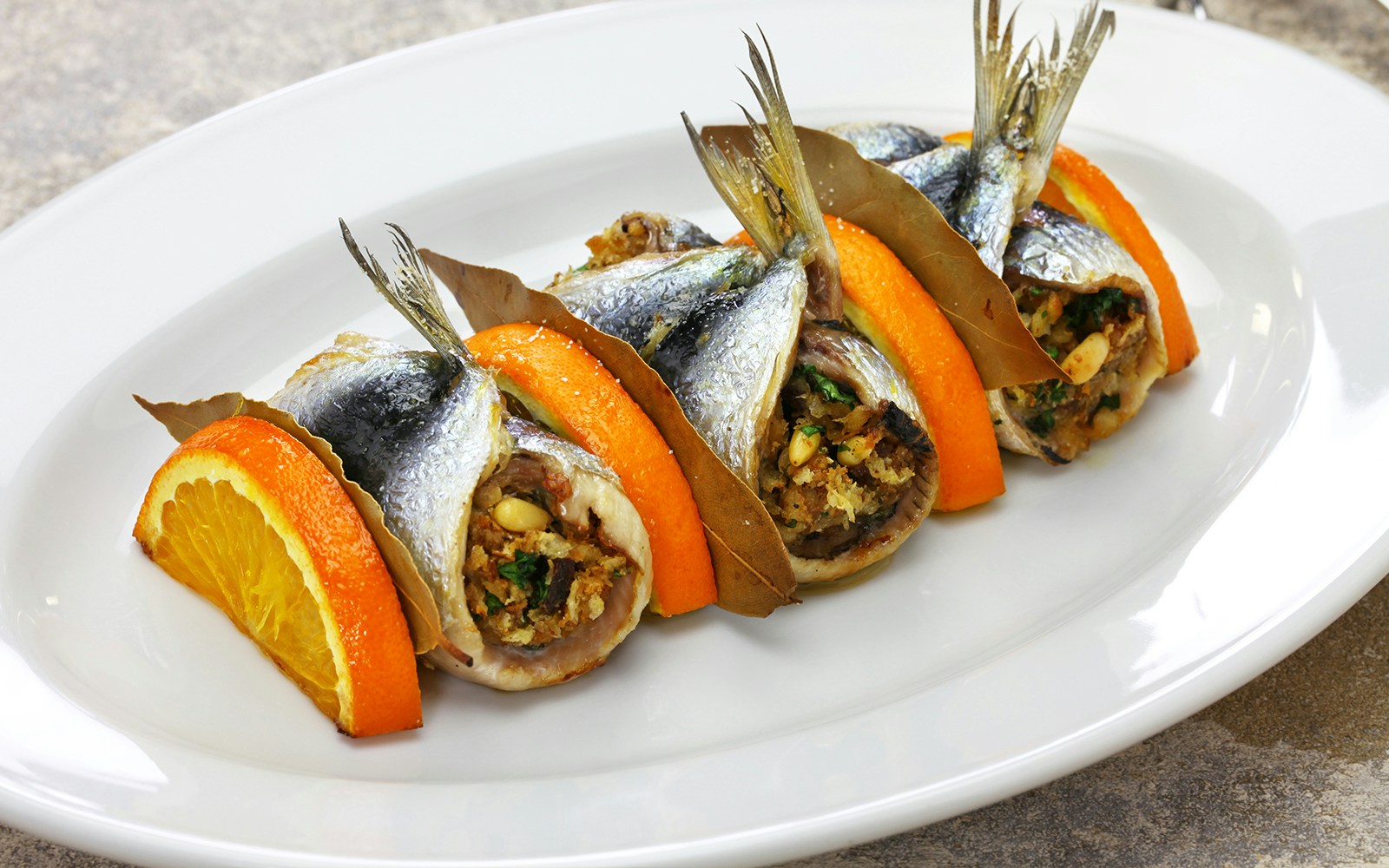 Sarde a Beccafico dish showcasing Sicilian cuisine with stuffed sardines.