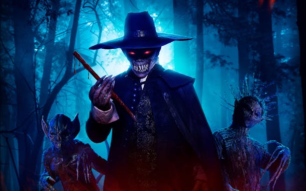 Characters in eerie forest setting at Universal Studios Singapore R.I.P tour.