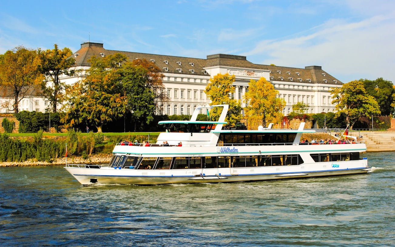 Gilles boat cruising past a historic building on the Middle Rhine Valley Castles & Palaces Boat Tour.