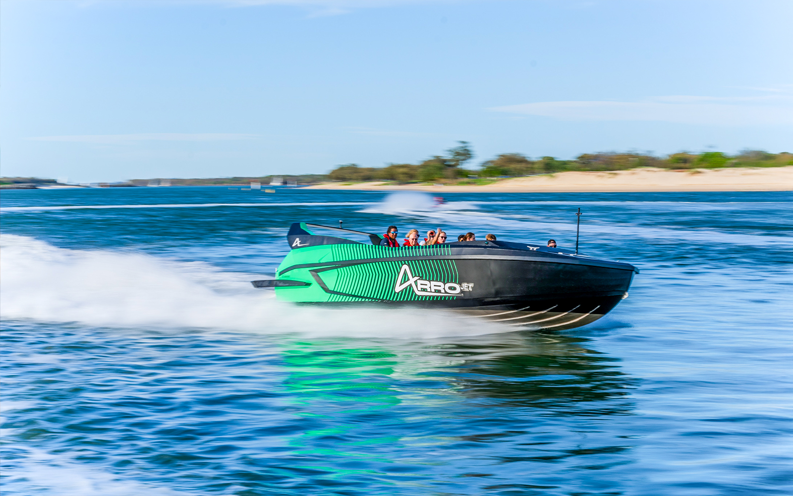 Arro Jet Boat speeding on the Gold Coast waters with passengers.