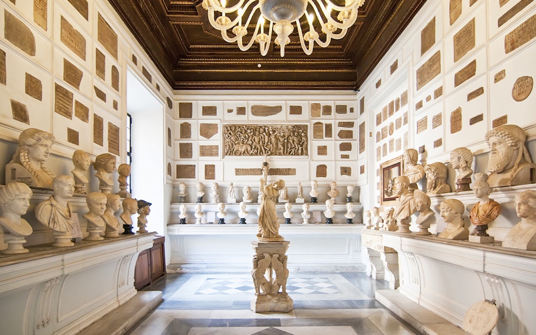 Busts and sculptures in a gallery at Musei Capitolini, Rome.