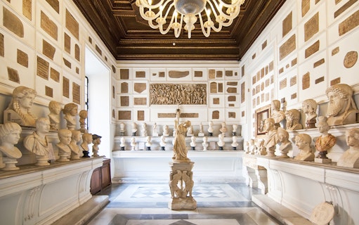 Busts and sculptures in a gallery at Musei Capitolini, Rome.