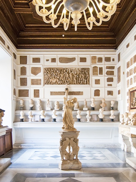 Busts and sculptures in a gallery at Musei Capitolini, Rome.