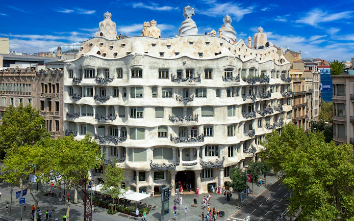 La Pedrera-Casa Milà in Barcelona, view of the unique facade and rooftop sculptures.