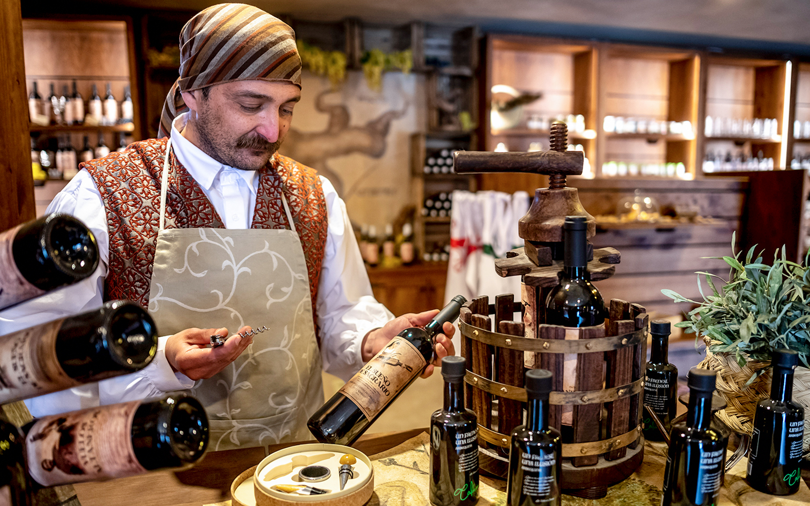Man holding bottles at Puy du Fou España historical theme park.