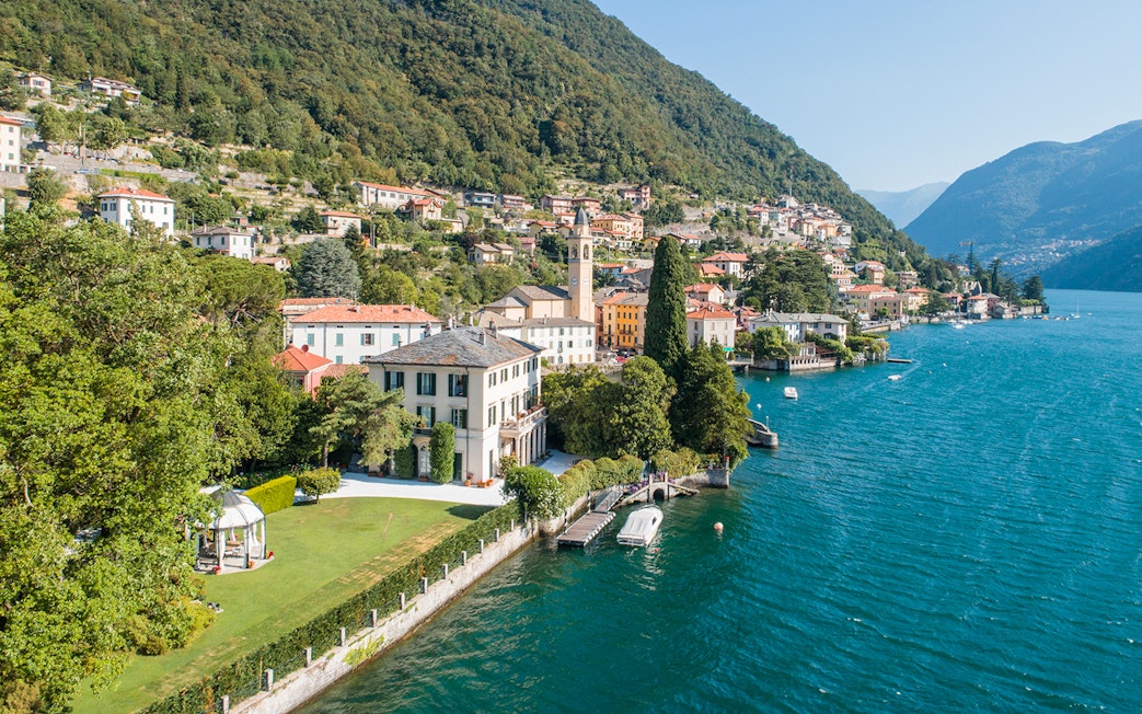 George Clooney's residence on Lake Como, Italy, with scenic waterfront and hillside village.