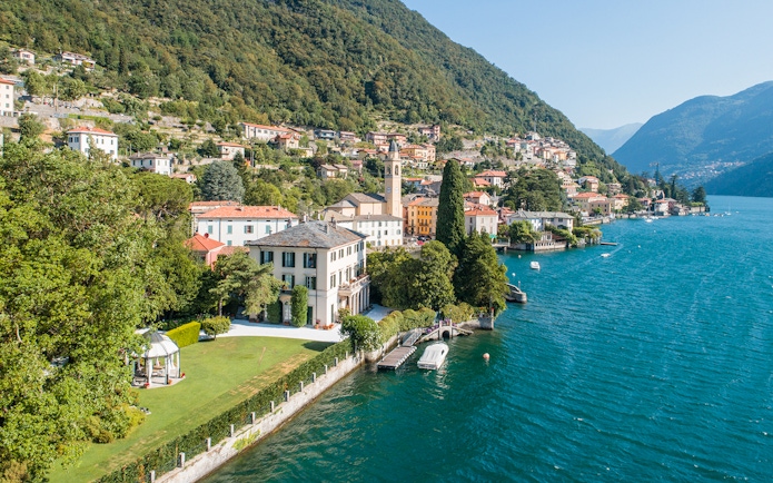 George Clooney's residence on Lake Como, Italy, with scenic waterfront and hillside village.
