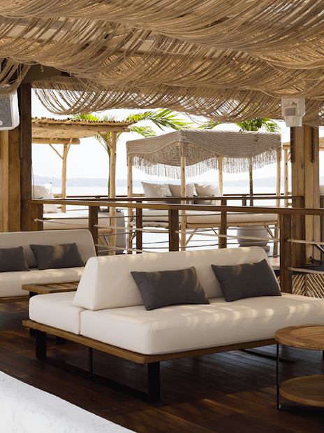 Sunset terrace at Yona Beach Club in Phuket with lounge seating and ocean view.