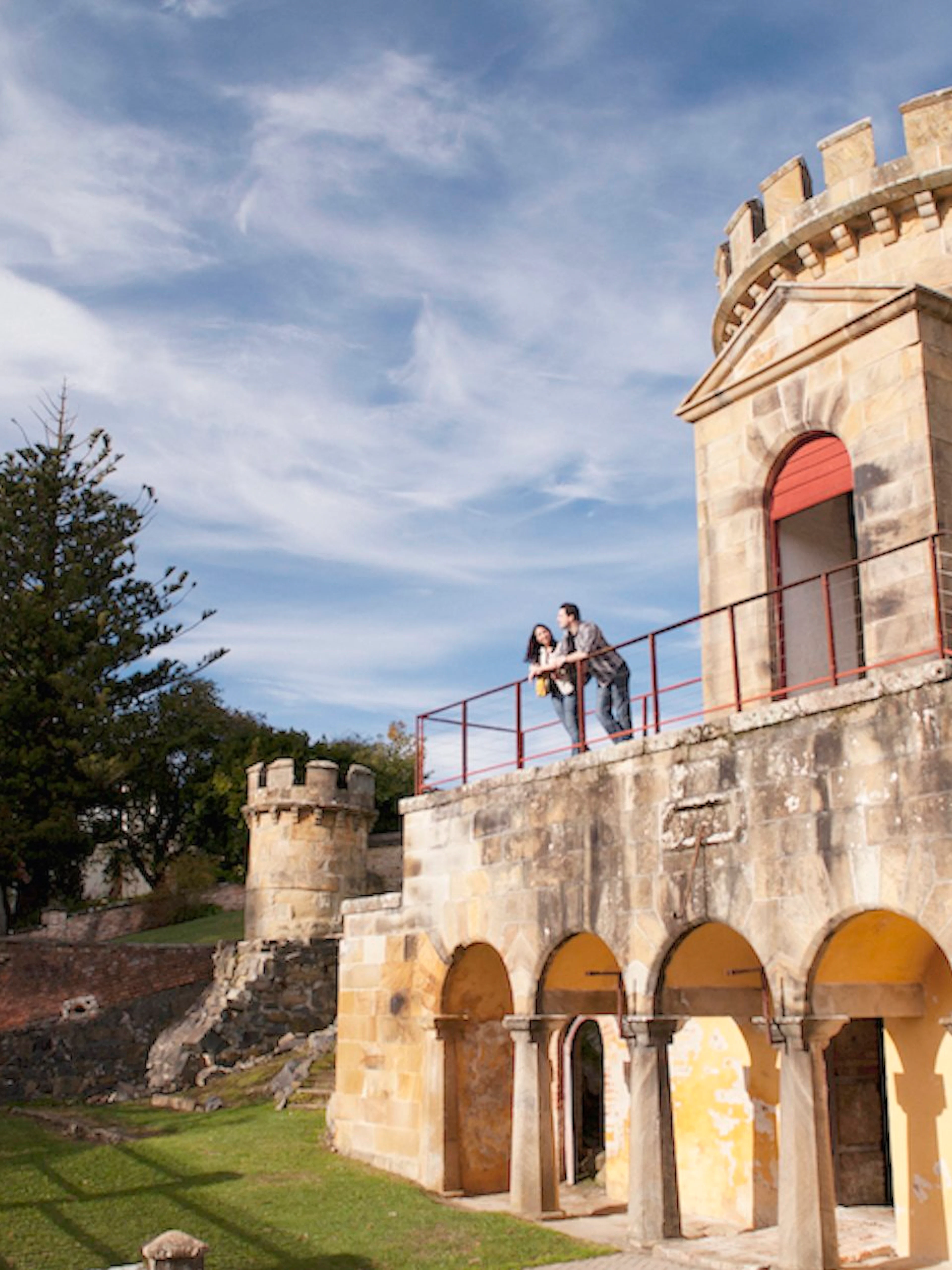 Historic building with visitors on the balcony at Port Arthur, Tasman Peninsula.