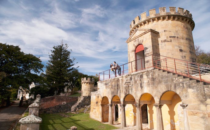 Historic building with visitors on the balcony at Port Arthur, Tasman Peninsula.