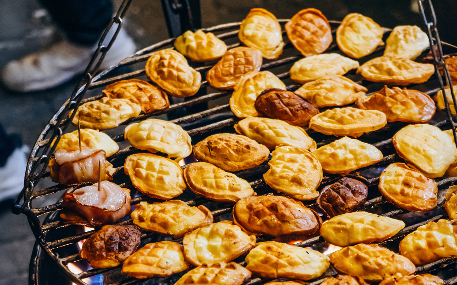 Grilled oscypek cheese on a barbecue during a Zakopane full-day trip.