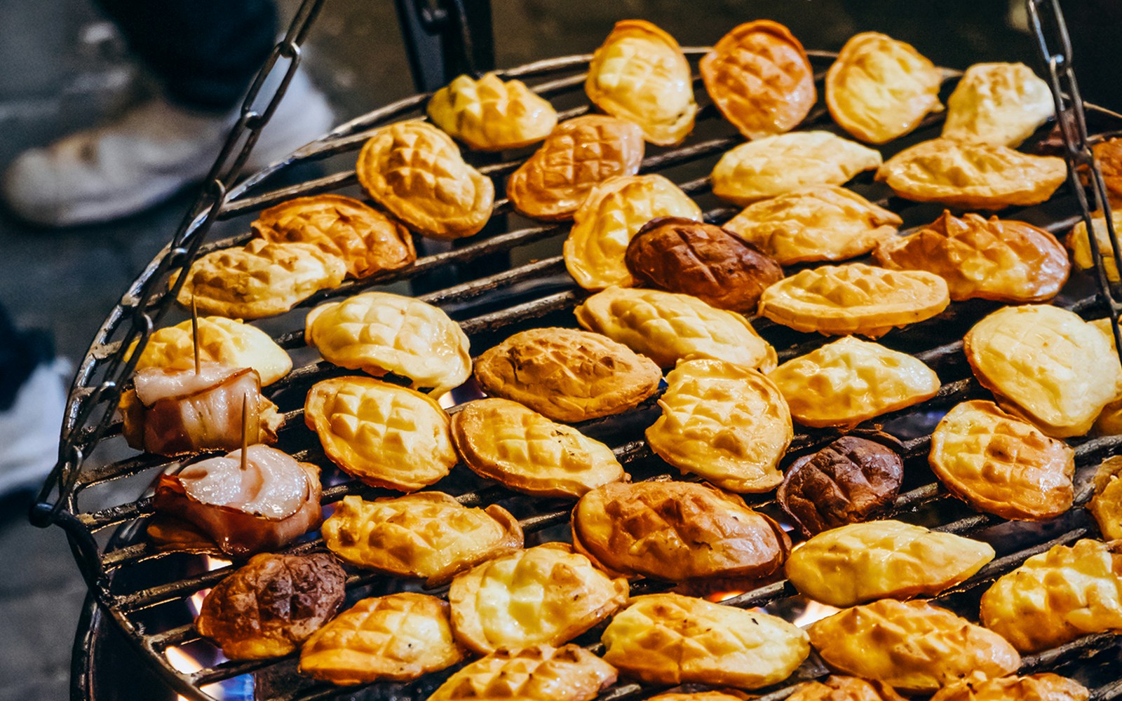 Grilled oscypek cheese on a barbecue during a Zakopane full-day trip.
