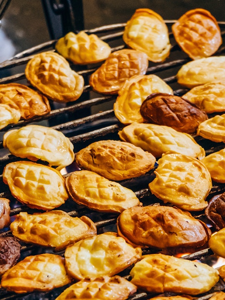 Grilled oscypek cheese on a barbecue during a Zakopane full-day trip.