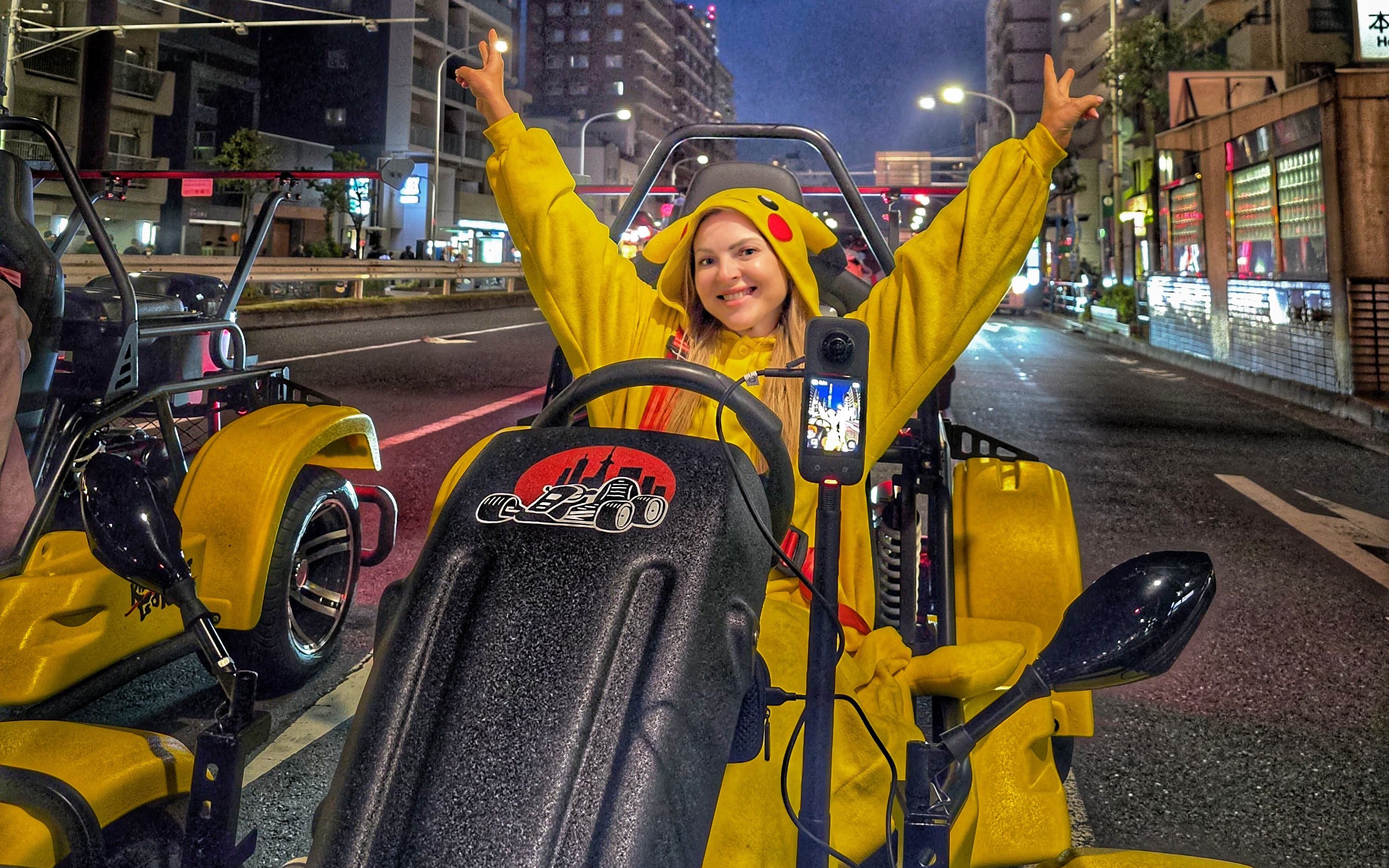 Person in costume driving a go-kart on Tokyo street during Go Kart Tokyo Old Town Tour.