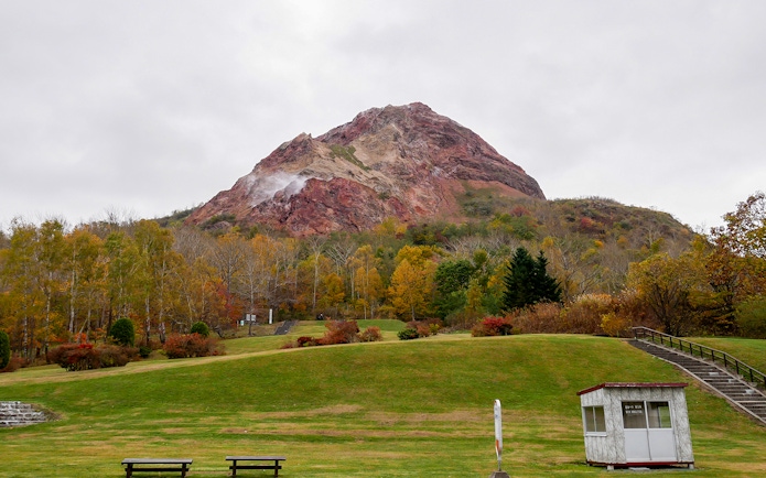 Mount Usu with autumn foliage in Noboribetsu, Japan, part of a guided day trip from Sapporo.