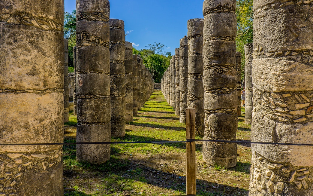 Row of stone columns at Chichen Itza ruins in Yucatan, Mexico.