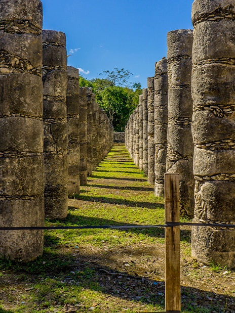 Row of stone columns at Chichen Itza ruins in Yucatan, Mexico.