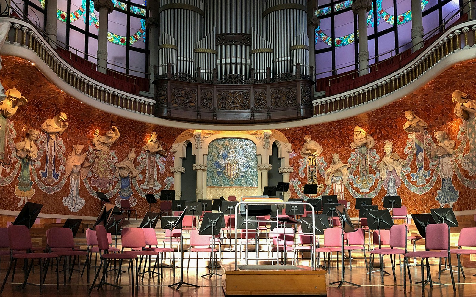 Concert stage with ornate backdrop at Palau de la Musica Catalana, Barcelona.